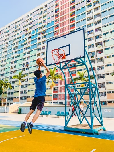 In the blue shirt and black shorts to play basketball during the day
